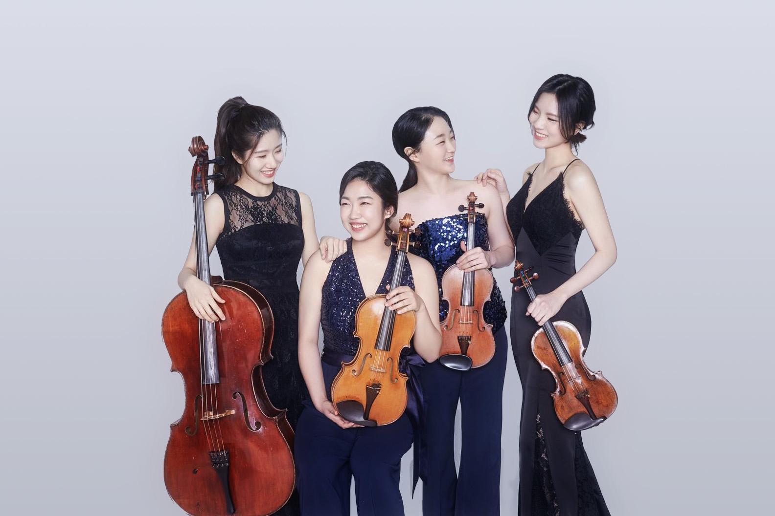 An image of Risus Quartet with their instruments 