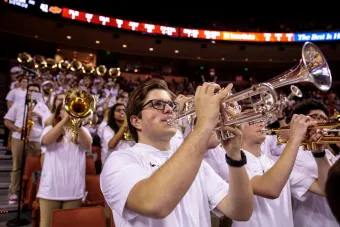 Members of Longhorn Pep Band perform at a basketball game