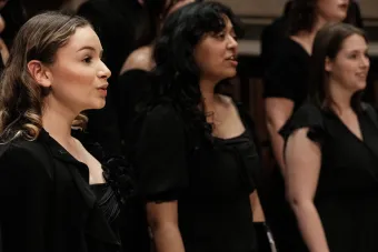 the Treble Chorus performs on stage