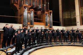 Tenor/bass chorus poses for a photo on the bates stage