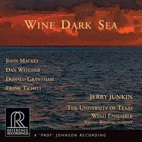Album cover; a dark blue sea scape at sunset